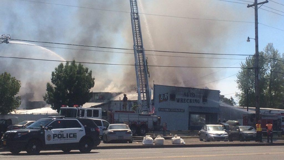 Fire at auto wrecking yard contained to building KVAL