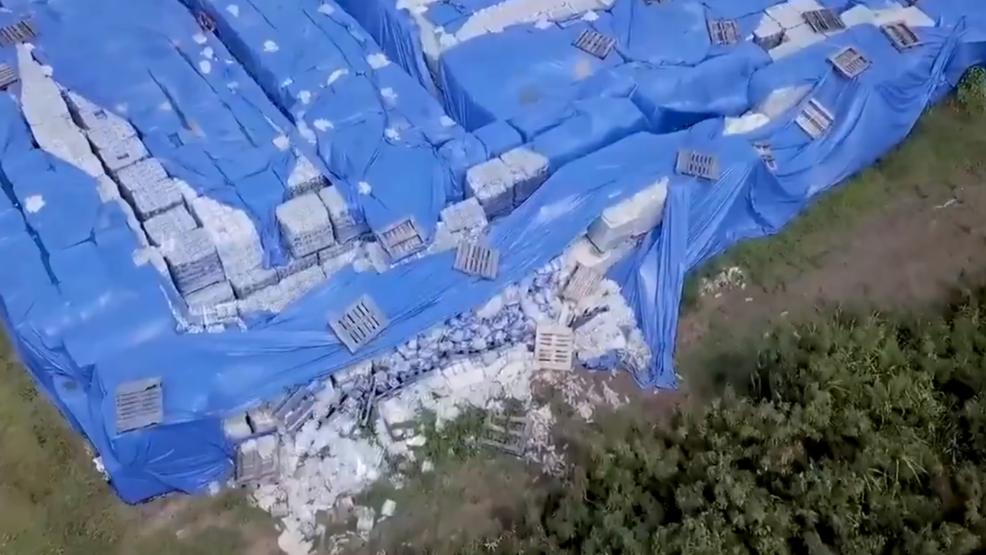 Thousands of pallets of bottled water found untouched in stormdamaged