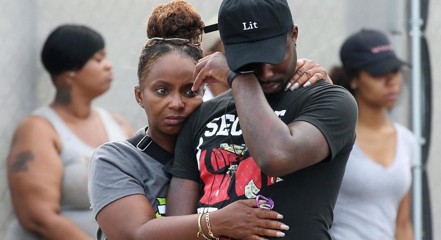 Chicago Violence Chicago 73 shot man wipes tear AP67.jpg