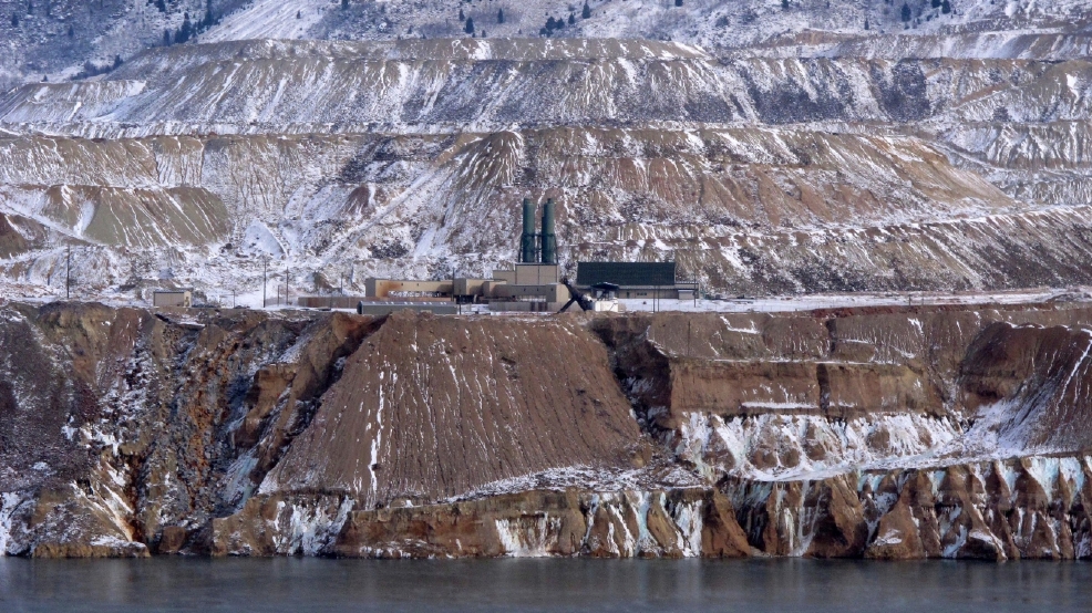 Brimming toxic pit nears critical level after bird deaths